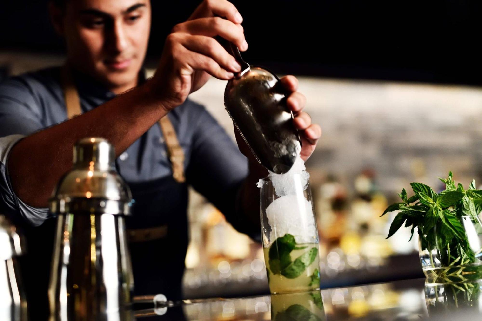 Amman Marriott Hotel Exterior photo A bartender preparing a cocktail